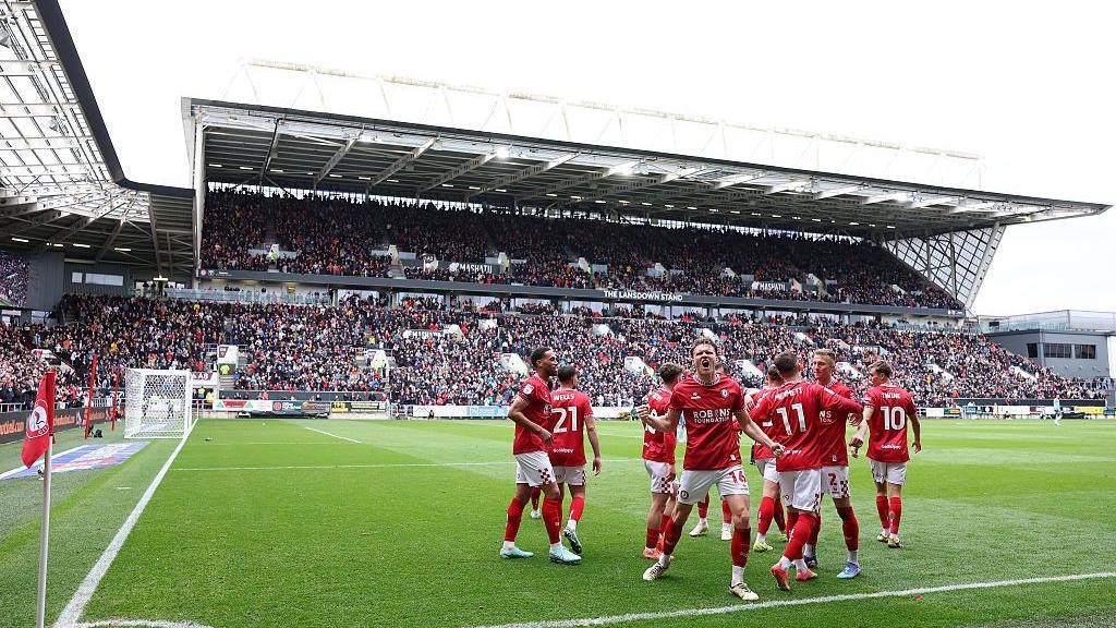 Rob Dickie and team-mates celebrate a goal against Sunderland at Ashton Gate