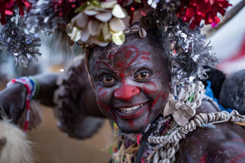 A man with white face paint and red markings performs at the Nyege Nyege Festival in Jinja, Uganda. 