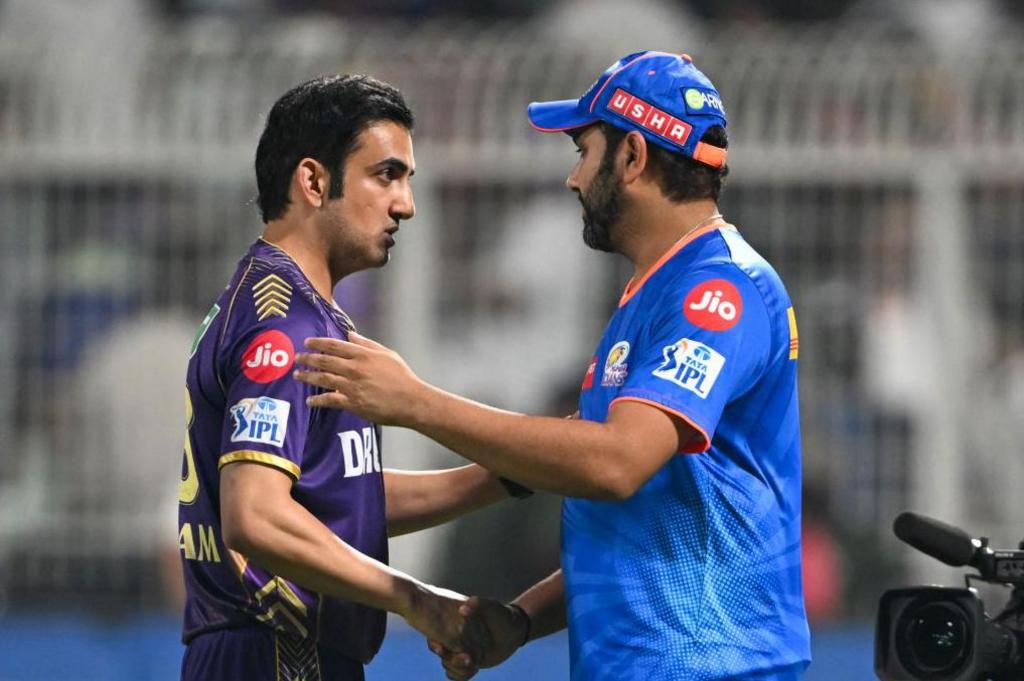 Mumbai Indians' Rohit Sharma (R) greets Kolkata Knight Riders' mentor Gautam Gambhir at the end of the Indian Premier League (IPL) Twenty20 cricket match between Kolkata Knight Riders and Mumbai Indians at the Eden Gardens in Kolkata on May 11, 2024.