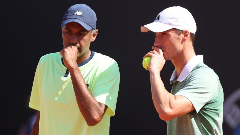 Rajeev Ram of United States and Joe Salisbury of Great Britain talk during the Men's Doubles second round