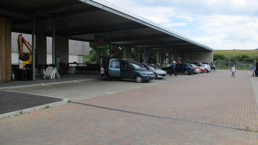 Several cars pictured in bays at Bridport's household recycling centre.