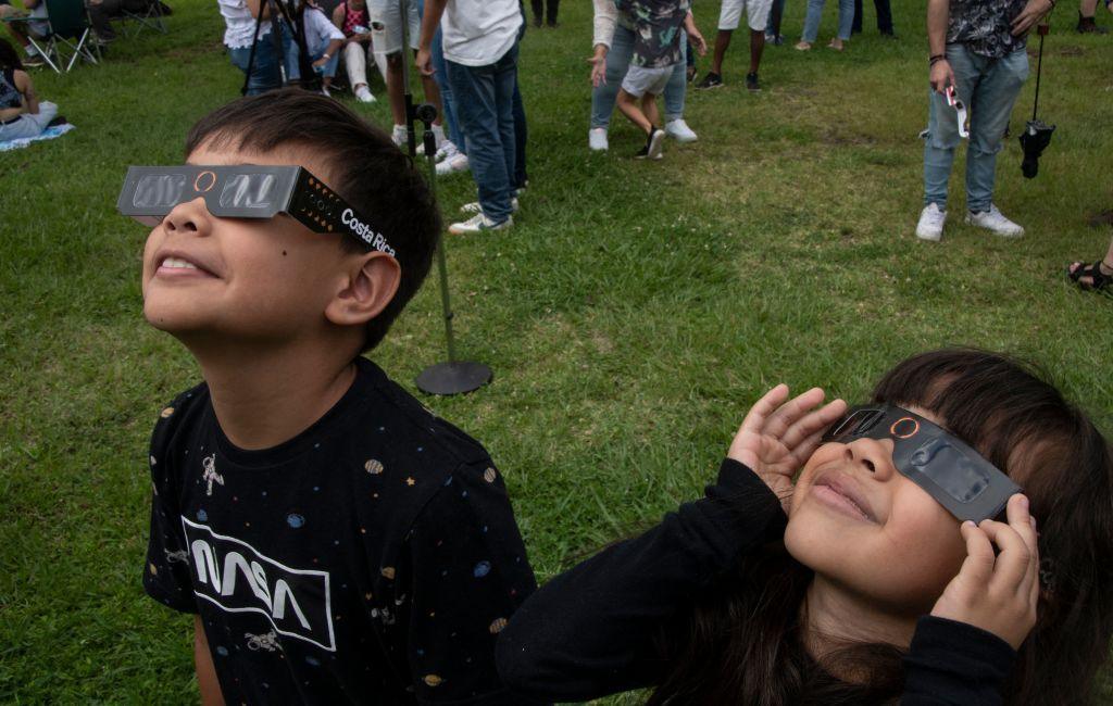 Children watching annular eclipse.