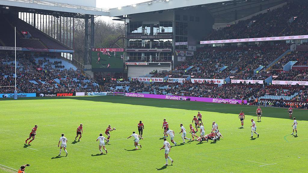 A general aerial view of the pitch at Villa Park and the stands with Gloucester and Leicester players in action