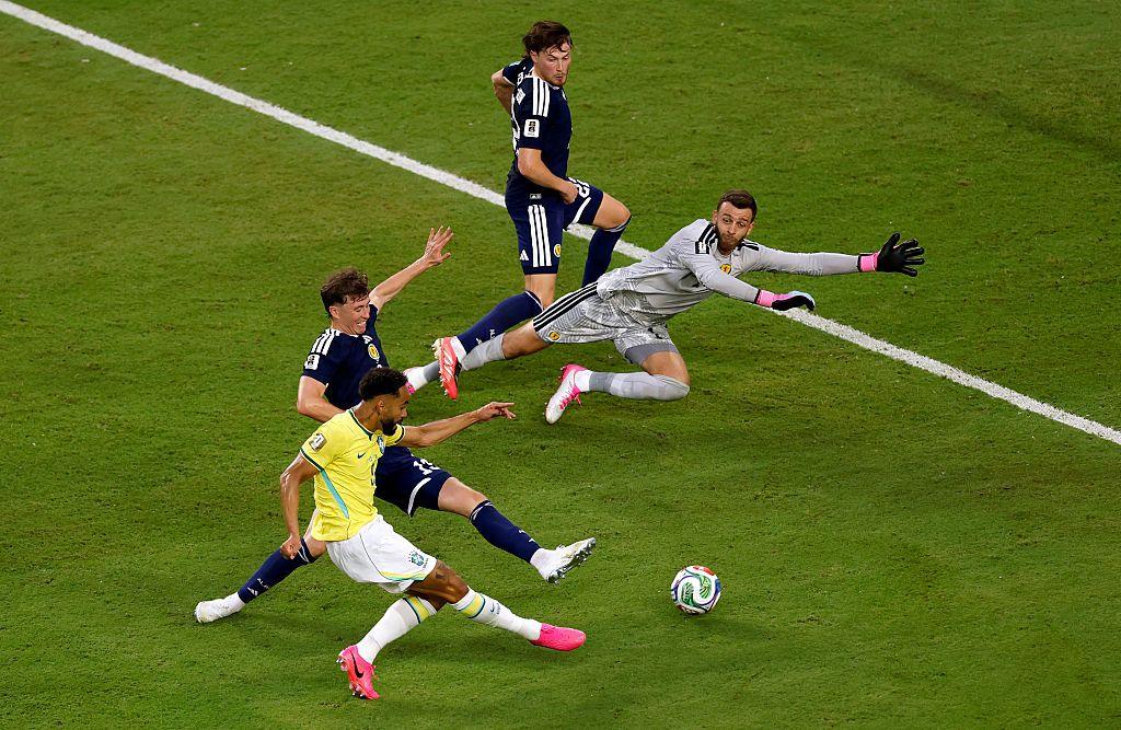 Matheus Cunha #9 of Brazil scores his team's third goal during the FIFA World Cup 2026 Group C match between Scotland and Brazil 