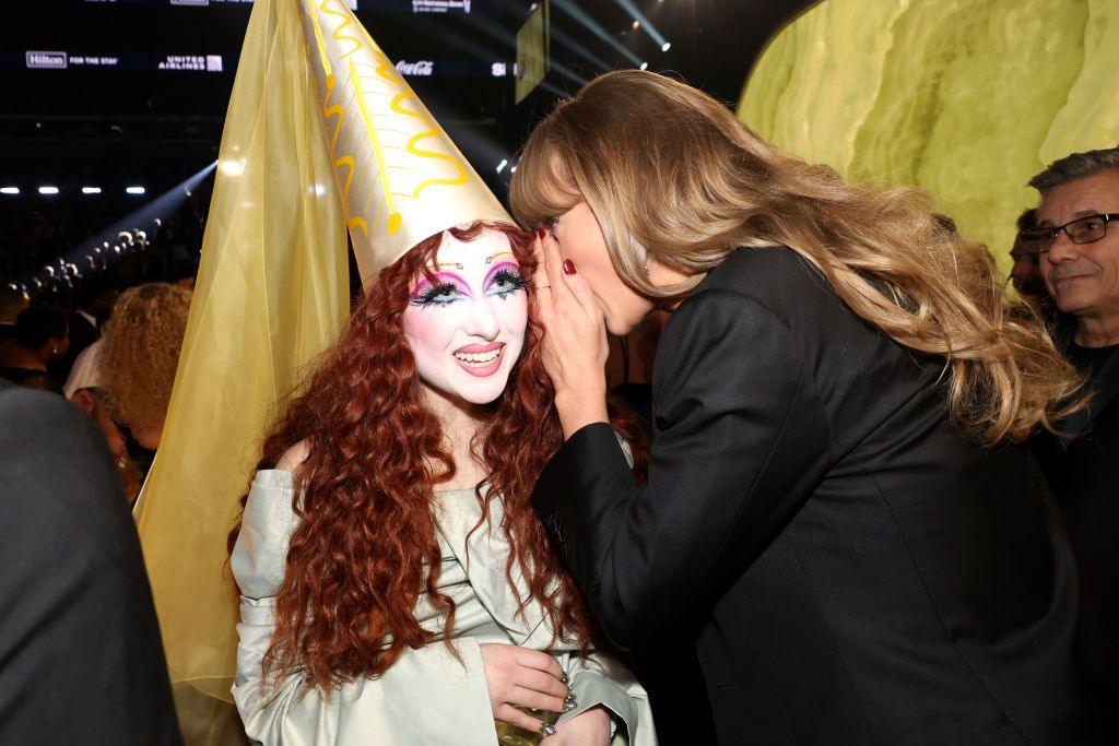 Taylor Swift whispers into Chappell Roan's ear