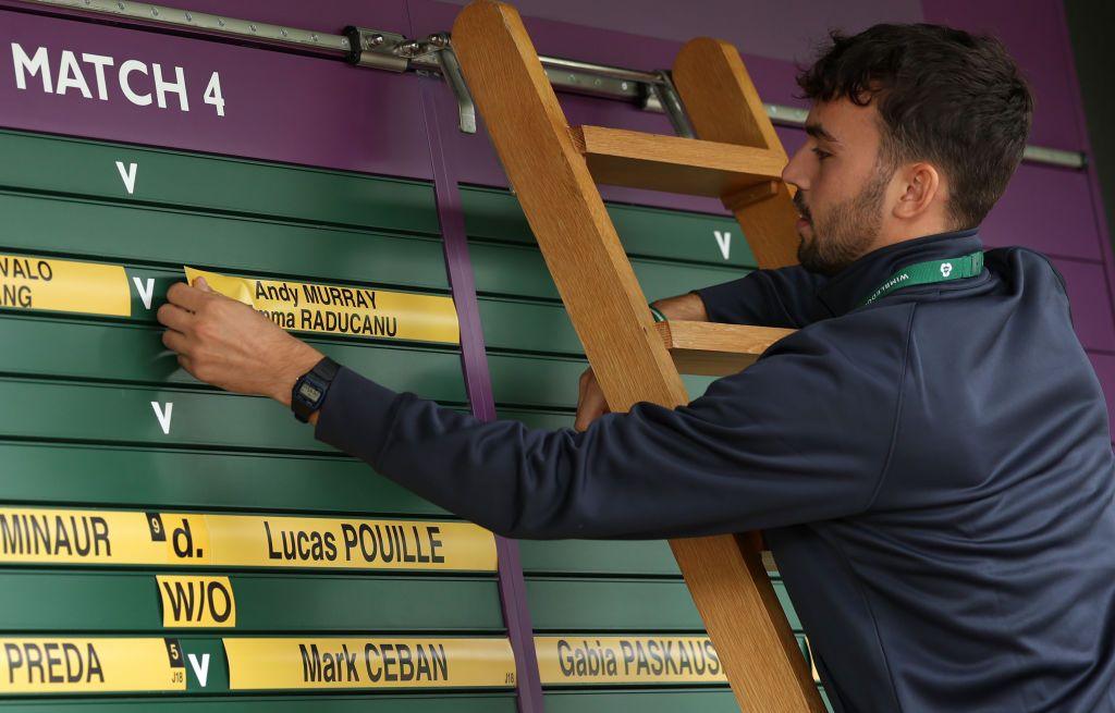 Scoreboard showing Emma Raducanu and Andy Murray at Wimbledon