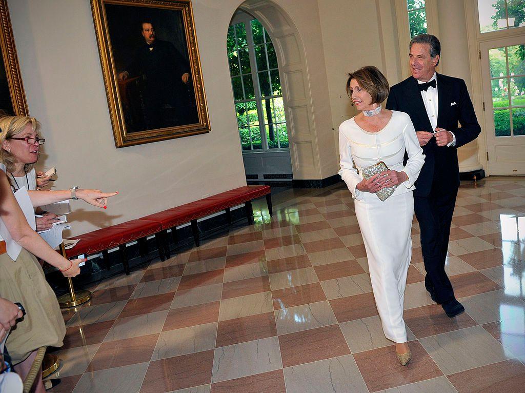 Nancy and Paul Pelosi arrive dressed up for an event in the White House East Wing