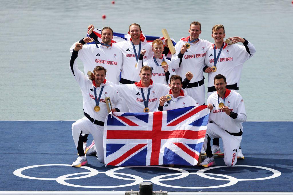 Team Great Britain celebrate with Gold medals in the Men's Eight Finals