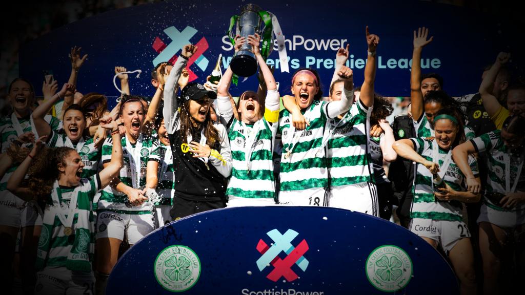 Celtic players celebrate their title win