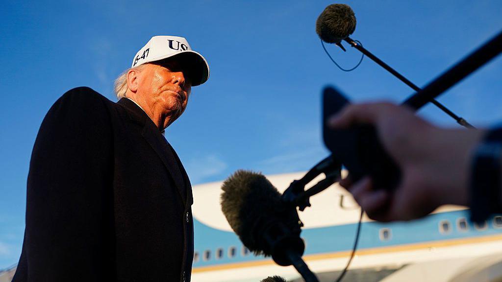 Donald Trump speaks to reporters in front of Air Force One