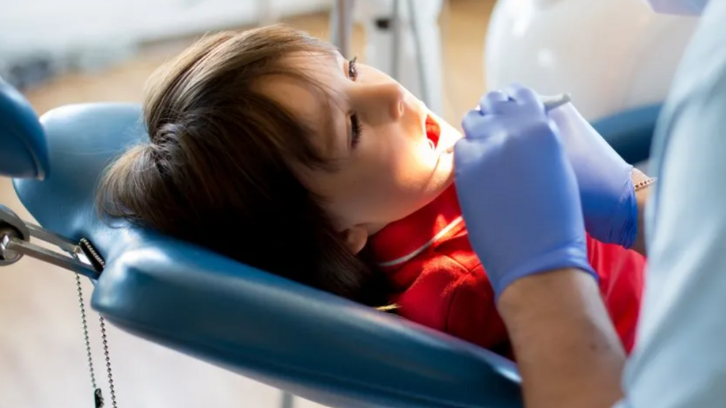 child having teeth checked