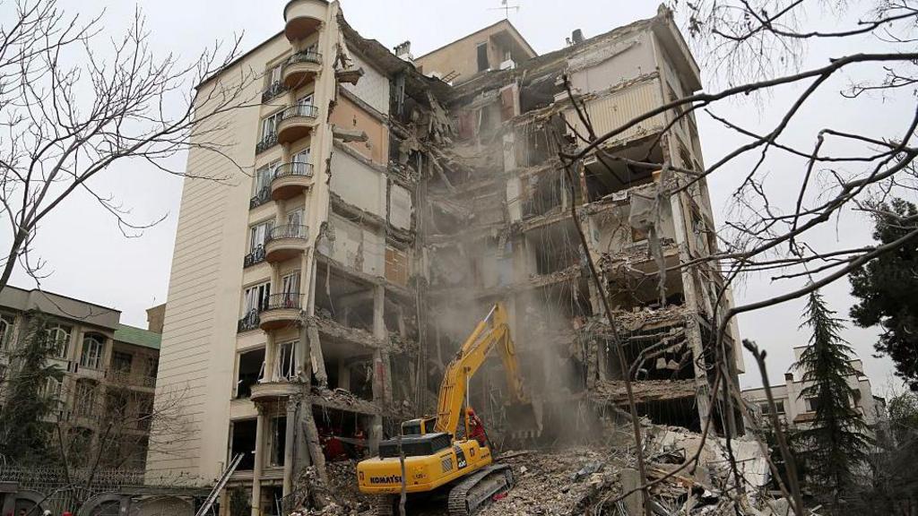 Civil defense and search and rescue teams continue operations in the area after U.S. and Israeli strikes targeted the Enderzgu district of the Iranian capital Tehran at dawn