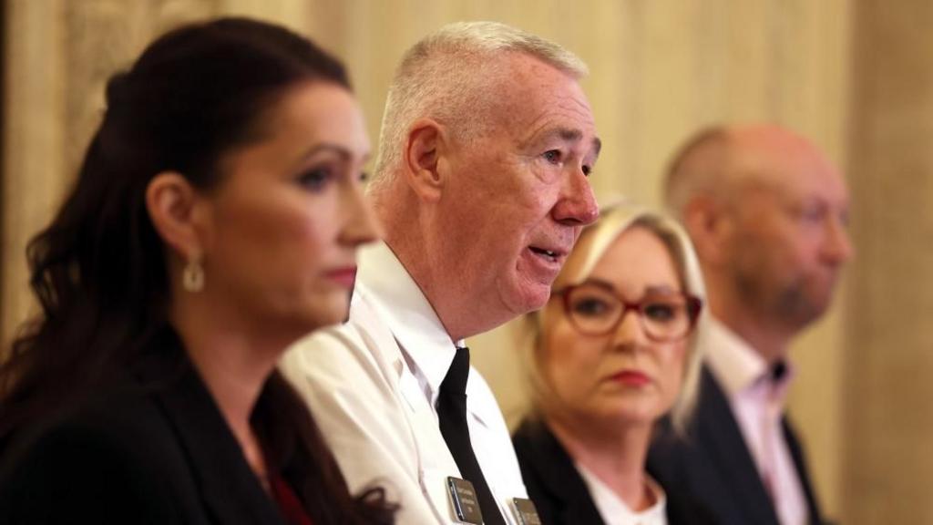  deputy first Minister Emma LIttle-Pengelly, PSNI chief Constable Jon Boutcher, First Minister Michelle O'Neill and chair of the policing board Brenda Mullan speak at a news conference