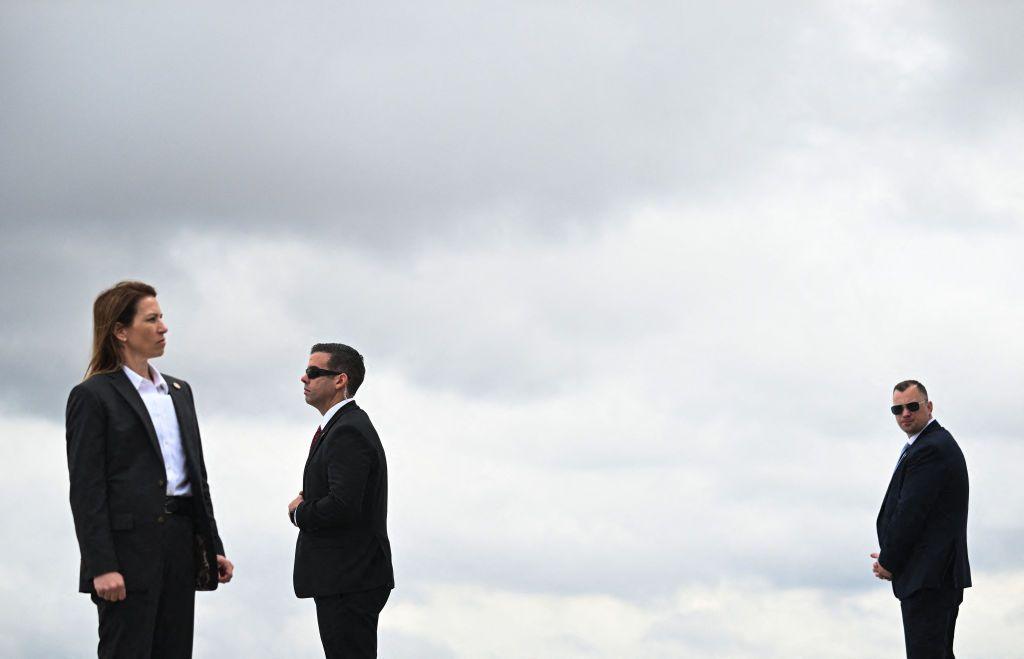 US Secret Service agent stand at their posts while waiting for the arrival of US President Joe Biden at Atlanta Hartsfield-Jackson International Airport