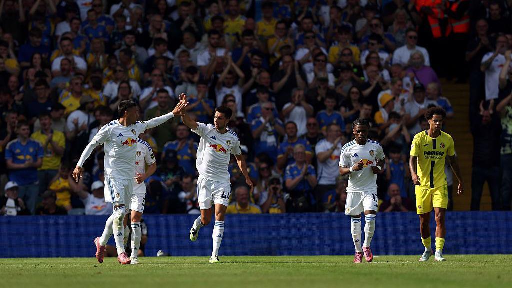Joel Piroe celebrates scoring his team's first goal with teammate Ilia Gruev during the pre-season friendly match between Leeds United and Villarrea