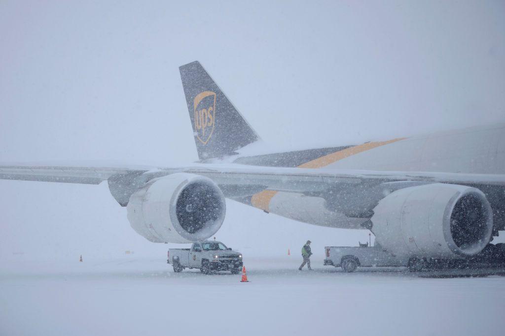 A UPS cargo jet sits parked in the snow at Louisville Muhammad Ali International Airport on 5 January 2025 