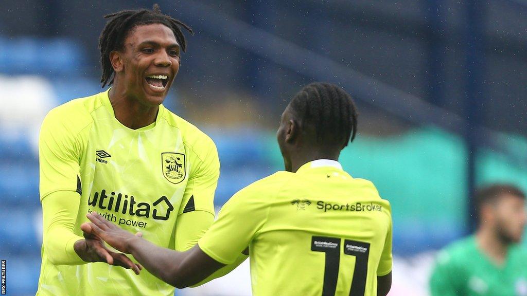 Kyle Hudlin celebrates scoring a goal for Huddersfield