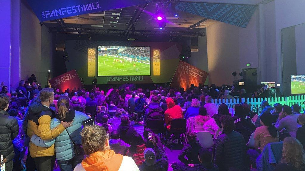 Fans at an indoor fan festival in Wellington, New Zealand, watch the co-hosts against Switzerland in the Women's World Cup