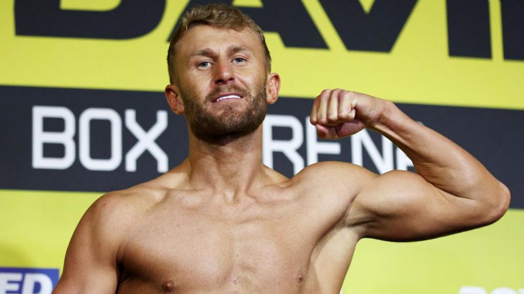 Boxer Lewis Edmondson poses for a photo at a weigh in