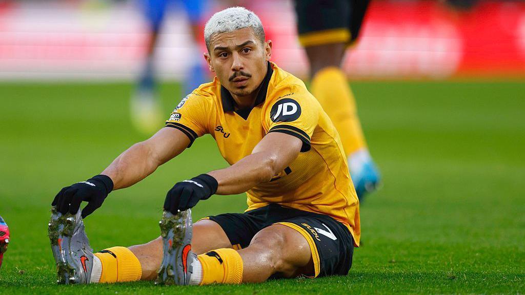 Wolves midfielder Andre sat down stretching