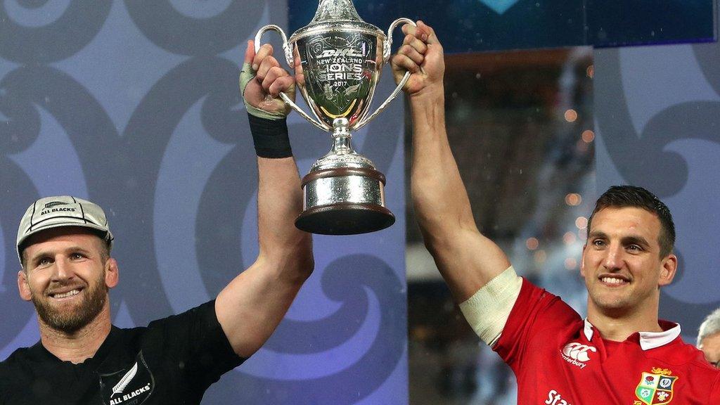 All Blacks captain Kieran Read and Lions counterpart Sam Warburton lift the trophy after the series is shared