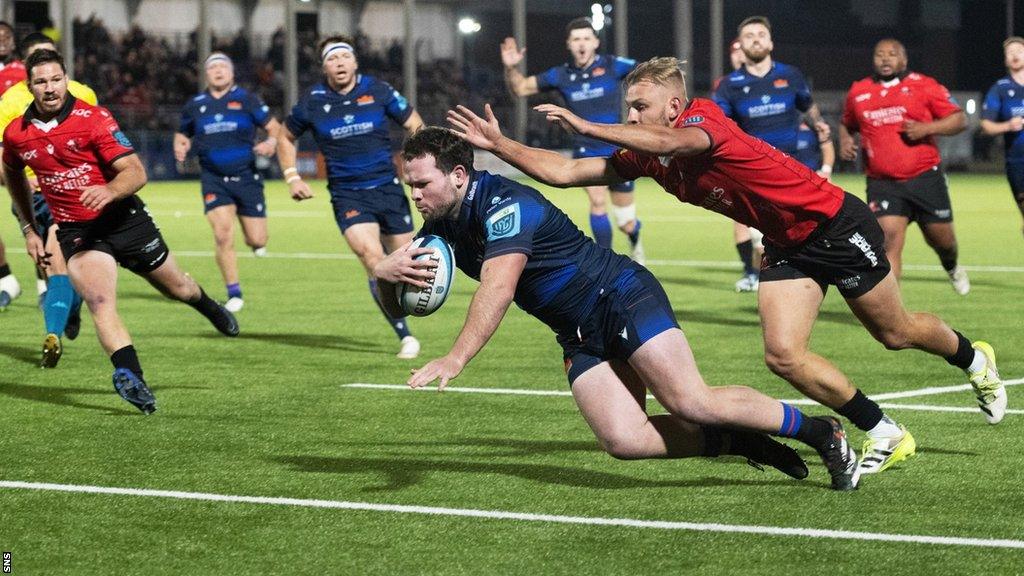 Ewan Ashman scores a try for Edinburgh against Lions