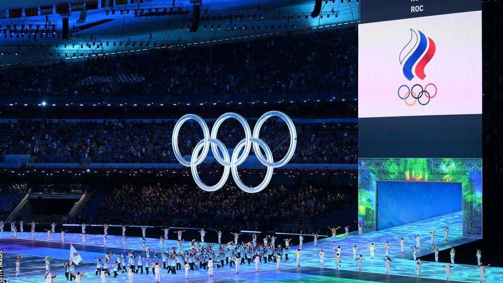 Team ROC carry flags during the Opening Ceremony of the Beijing 2022 Winter Olympics