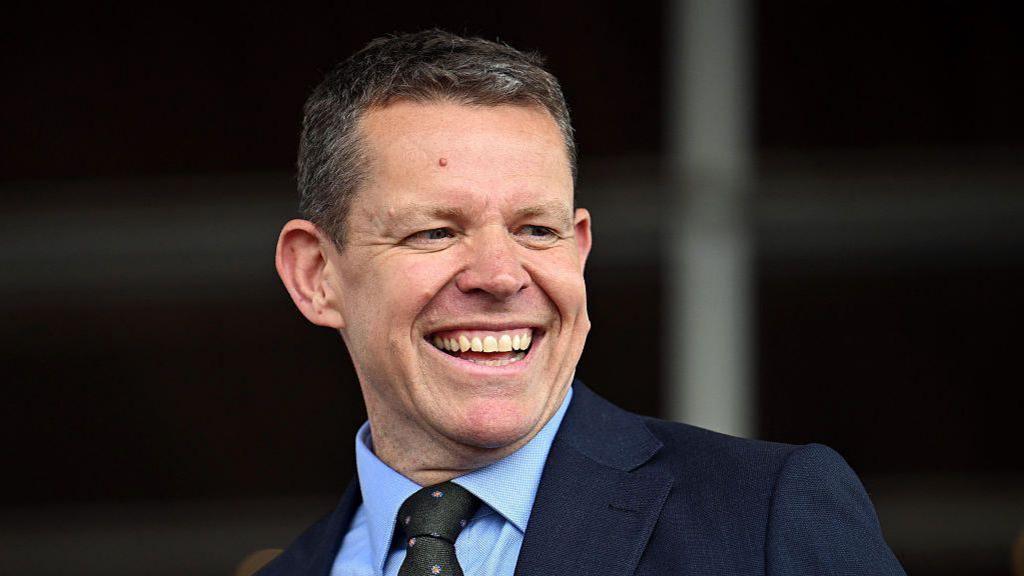 Rhun ap Iorwerth smiling.