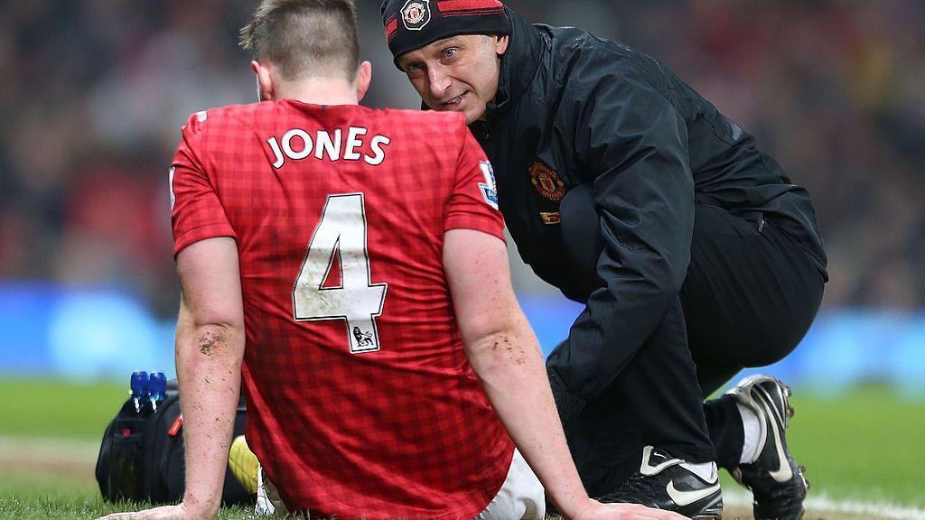 Phil Jones receives treatment during Manchester United's FA Cup tie against Reading in 2013