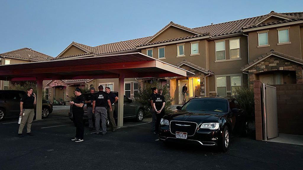 Forensic agents are seen at the apartment complex where Tyler Robinson is said to live in St George, Utah