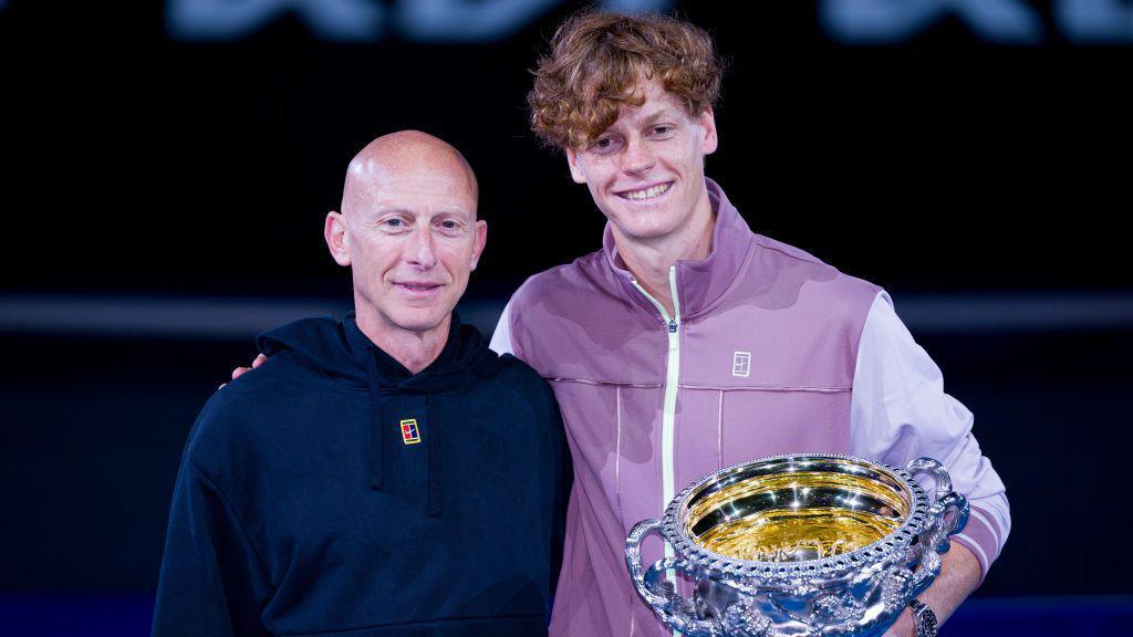 Umberto Ferrara and Jannik Sinner with the Australian Open trophy in 2024