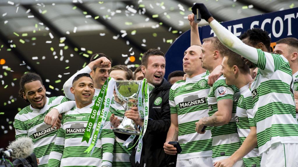 Celtic players celebrating with the Scottish League Cup