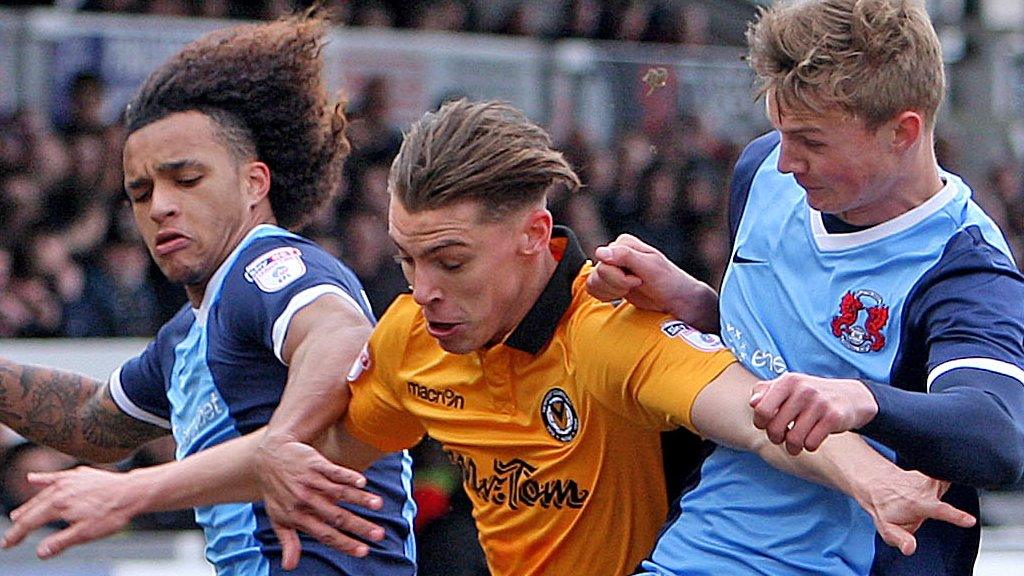 Newport's Sid Nelson is sandwiched between two Leyton Orient players