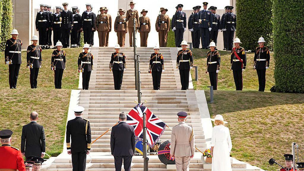 King Charles III, Queen Camilla and UK Prime Minister Sir Keir Starmer lay poppy wreaths at the National Memorial Arboretum .