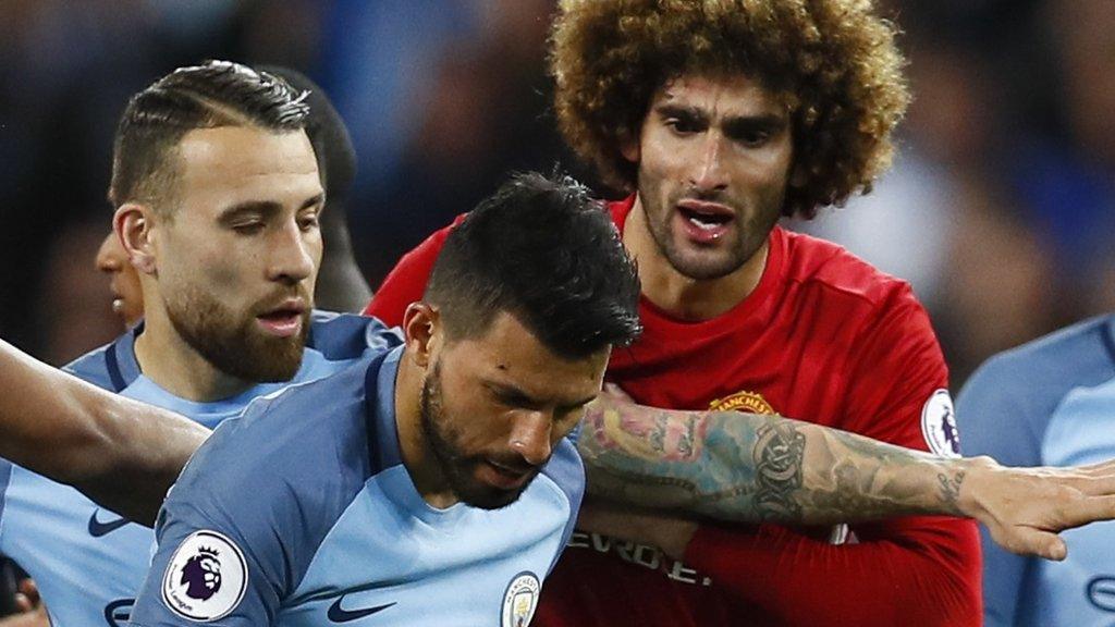 Marouane Fellaini tries to talk to Sergio Aguero after the headbutt