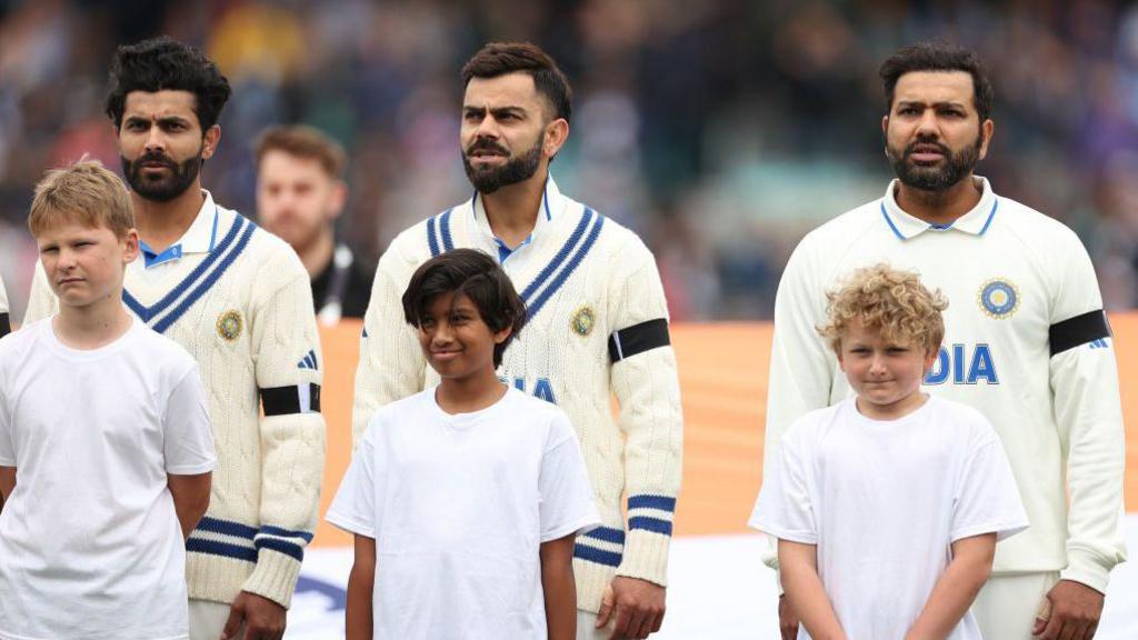 Ravindra Jadeja, Virat Kohli and Rohit Sharma of India stand during the national anthem during day one of the ICC World Test Championship Final between Australia and India at The Oval on June 07, 2023 in London, England. 