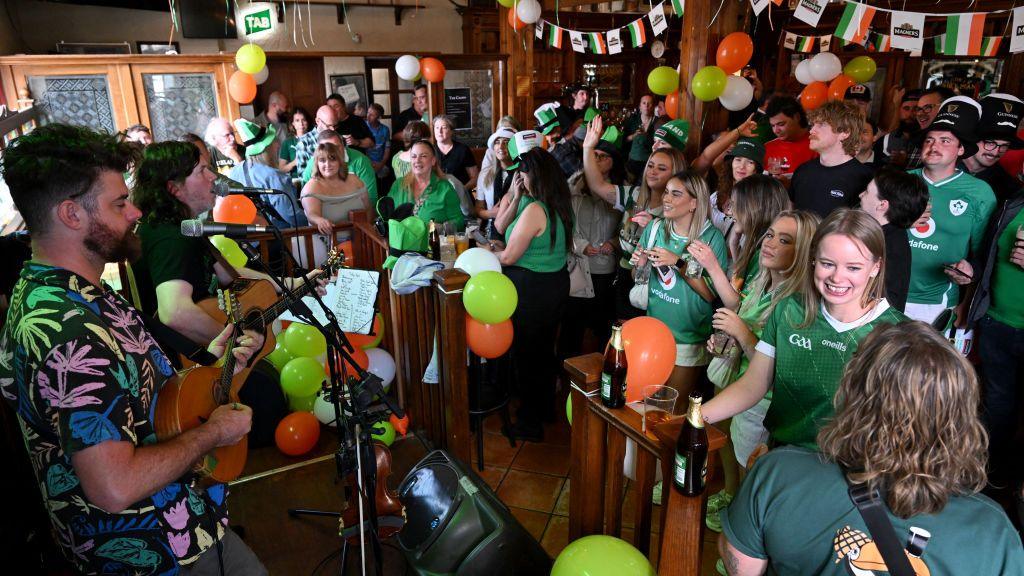 People attending Irish themed night in Melbourne, Australia. 