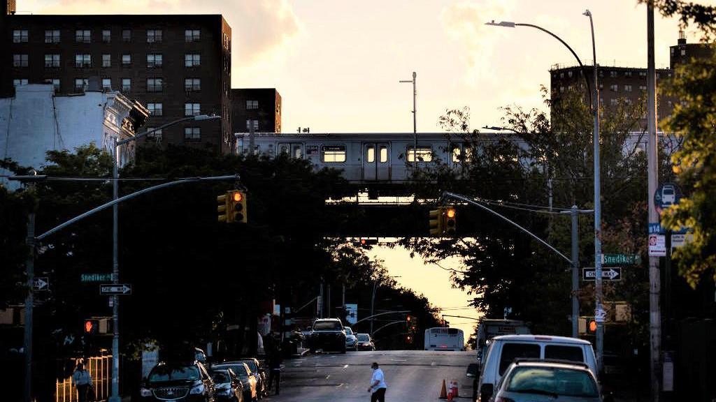 A train crosses Sutter Avenue in Brooklyn, New York