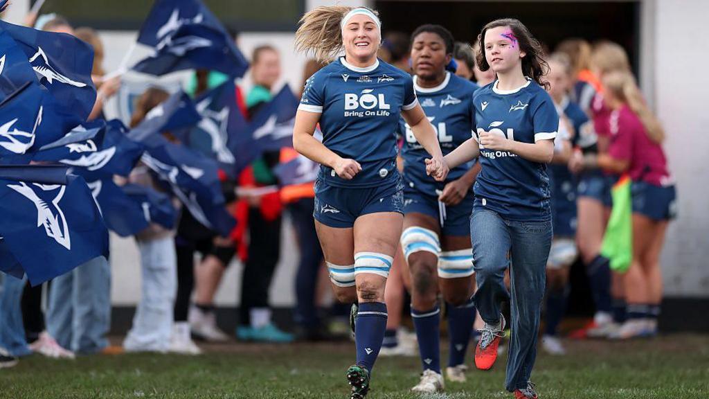 Sale players arriving on the pitch for a match