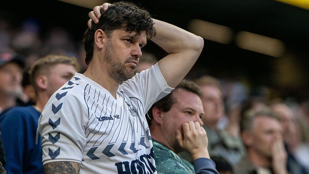 A Tottenham Hotspur fan reacts during the Premier League match between Tottenham Hotspur and Brighton & Hove Albion