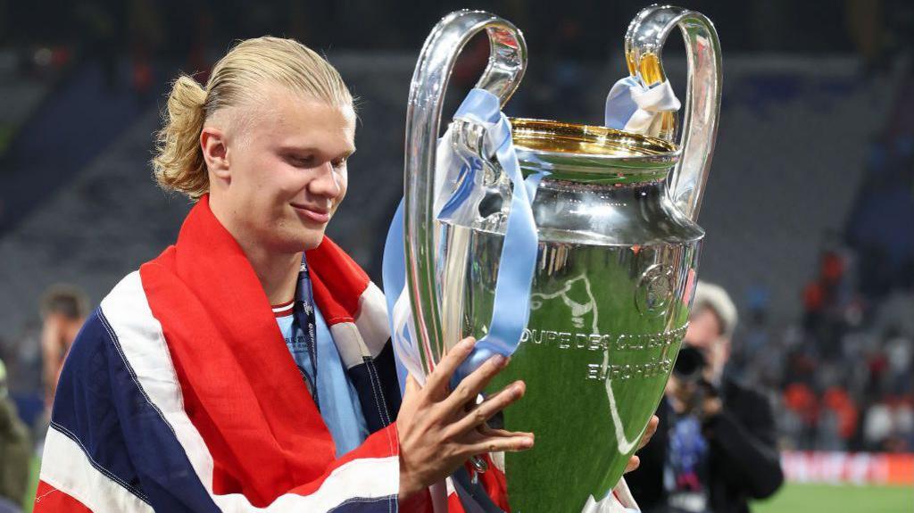 Erling Haaland with the Champions League trophy