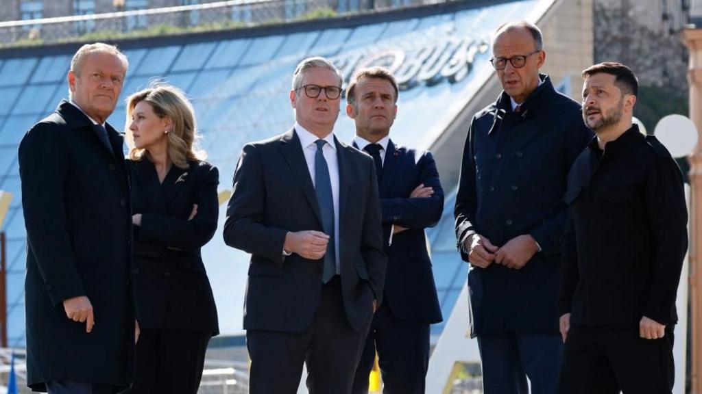 Tusk, Macron, Starmer, Merz, Zelensky and first lady of Ukraine Olena Zelenska stood together in Independence Square in Kyiv.