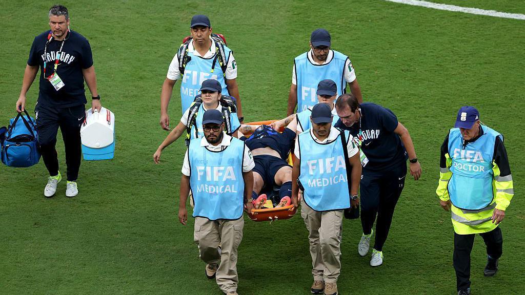 Manuel Ugarte is stretchered off