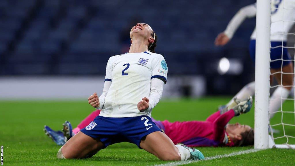 Lucy Bronze celebrates scoring against Scotland