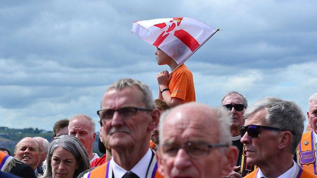 People attending the centennial parade in Belfast