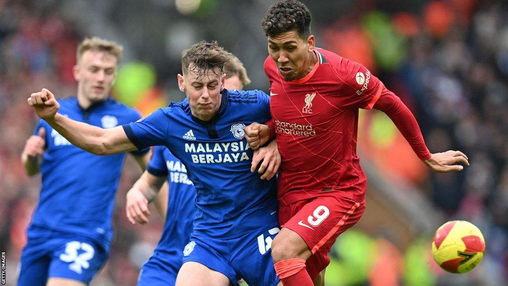 Ollie Denham tussles with Roberto Firmino