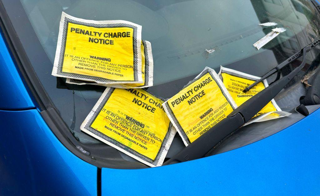 Five Penalty Charge Notices on a car windscreen on November 2024