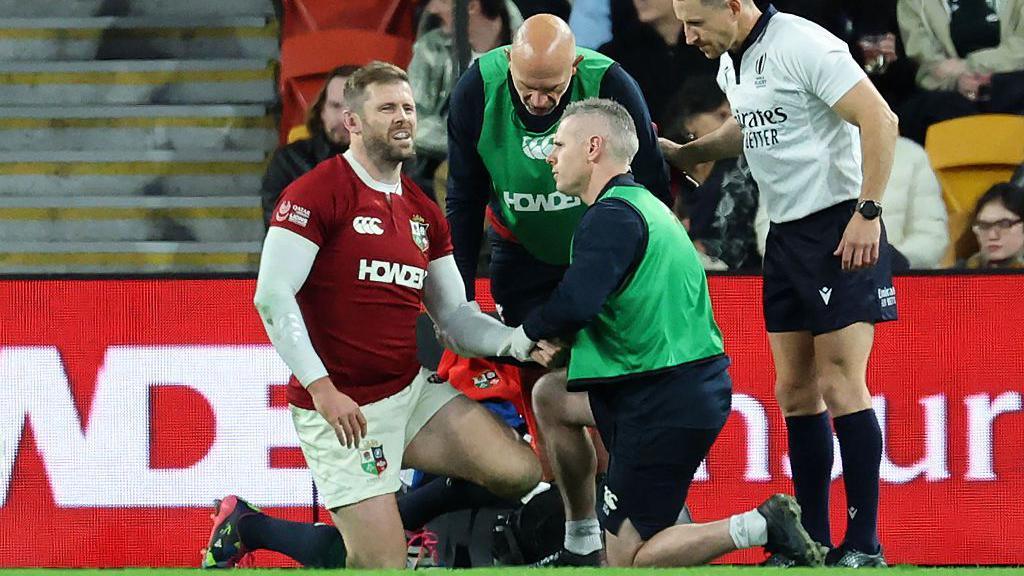 Elliot Daly gets treatment on his arm