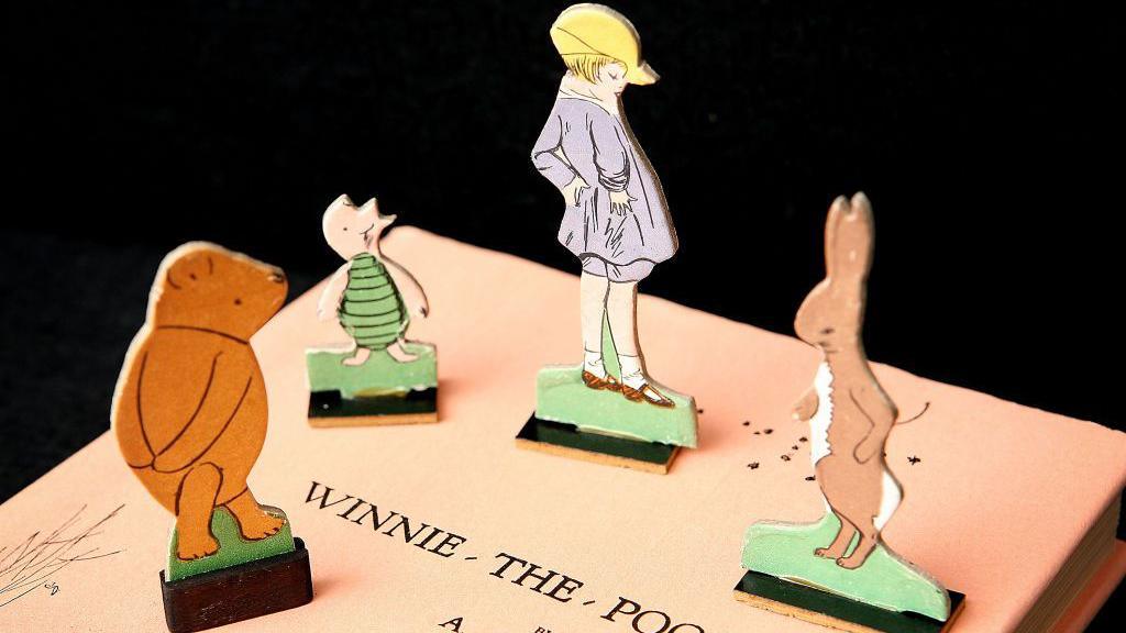 Winnie the Pooh book with characters.
