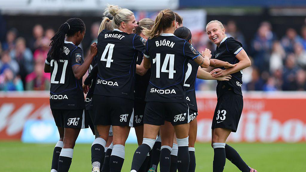 Chelsea players celebrate with Aggie Beever-Jones after she scores against West Ham